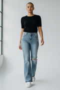 Cali's Closet Boutique Judy Blue distressed medium blue bootcut jeans with mid-rise waist and frayed hem.